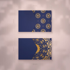 Dark blue business card with abstract gold pattern for your personality.