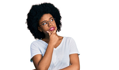 Fototapeta na wymiar Young african american woman wearing casual white t shirt thinking worried about a question, concerned and nervous with hand on chin