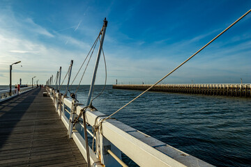 Obraz premium Fishing equipment on the peer to the Lighthouse, Nieuwpoort or Nieuport, Belgium