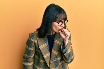 Young hispanic woman wearing business style and glasses feeling unwell and coughing as symptom for...
