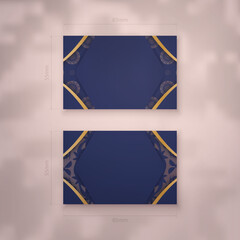 Presentable business card in dark blue with abstract gold ornaments for your brand.
