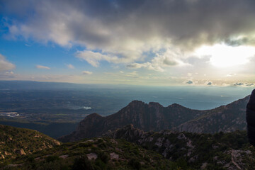 Picturesque landscape with mountains. Landscape and beautiful sunset on Montserrat mountain. Rock formations and cliffs in the Catalan Natural Park of Montserrat. Barcelona, Catalonia, Spain