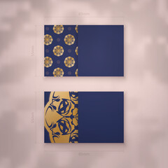 Presentable business card in dark blue with antique gold ornaments for your business.
