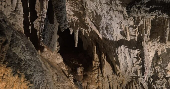 Beautiful shots of karst cave, Lipa Cave situated Serbia, East Europe. Illuminated dark cave with stalactites and stalagmites. Unique nature landscape. High quality 4k footage
