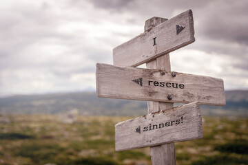 i rescue sinners text on wooden sign outdoors in nature. Religious and christianity quotes.