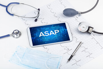 Close-up view of a tablet pc with medical abbreviation