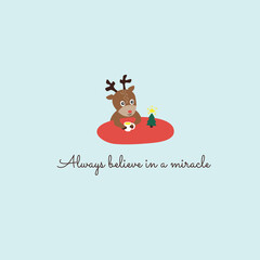 Fototapeta premium Сoncept of faith in Christmas miracle. Little deer drinks tea near tree. 