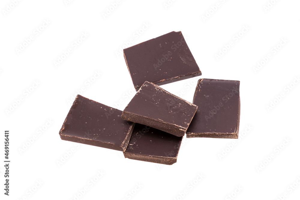 Poster pieces of dark chocolate in a heap isolated on white background