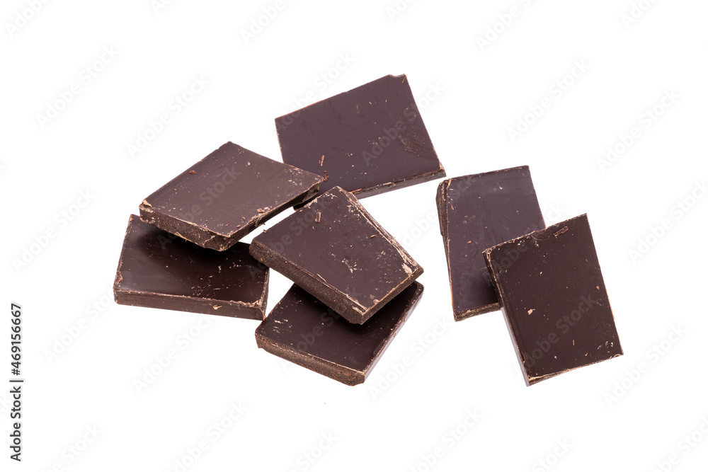 Poster dark chocolate in heap isolated on white background