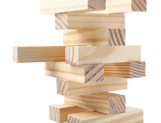 Jenga tower made of wooden blocks on white background