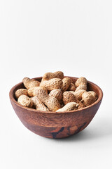  Bowl of peanuts with shell isolated on a white background