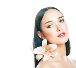 young attractive lady close up with hands on face isolated flower lily brunette spa nude makeup, beauty concept