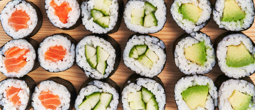  Group of avocado, salmon and cucumber sushi makis texture