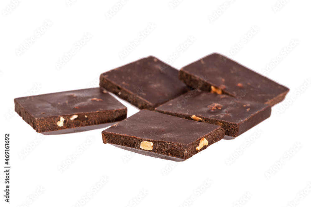 Aufkleber dark chocolate with nuts in a heap isolated on white background