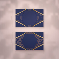 Visiting business card in dark blue with Indian gold pattern for your contacts.