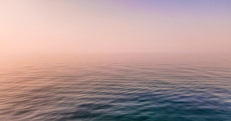 Fototapeta premium Calm Sea at sunset in pink colors