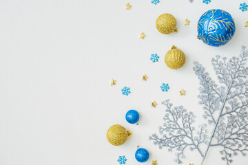 Flat lay frame with christmas balls on a white background. Merry christmas card and copy space for your text