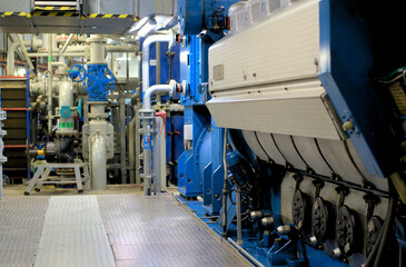 Main Diesel Electric Engine in Machinery Room on board modern ship