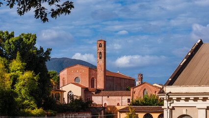 Lucca charming historical center. View of the city old skyline with medieval towers and St Francis...