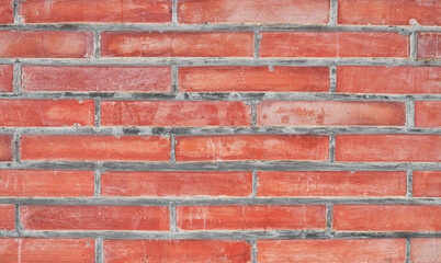 Fototapeta premium Brick wall texture with cracked tiles and cement. Classic brickwall surface background