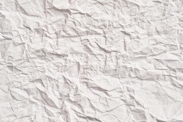 White crumpled paper texture with wrinkles. Damaged and torn sheet