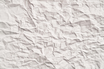 White crumpled paper texture with wrinkles. Damaged and torn sheet
