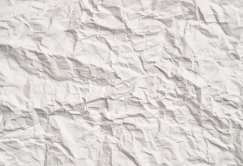 White crumpled paper texture with wrinkles. Damaged and torn sheet