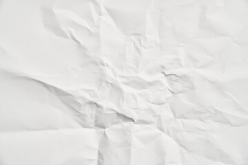 White crumpled paper texture with wrinkles. Damaged and torn sheet