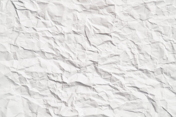 White crumpled paper texture with wrinkles. Damaged and torn sheet