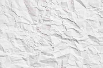 White crumpled paper texture with wrinkles. Damaged and torn sheet