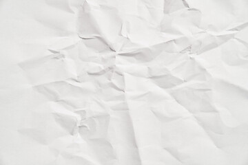 White crumpled paper texture with wrinkles. Damaged and torn sheet