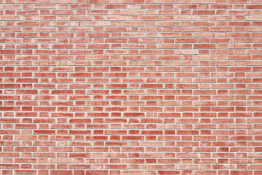Brick wall texture with cracked tiles and cement. Classic brickwall surface background