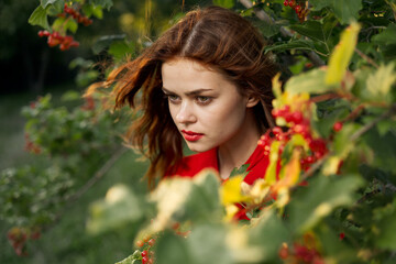 Naklejka premium beautiful woman bush with berries nature fresh air