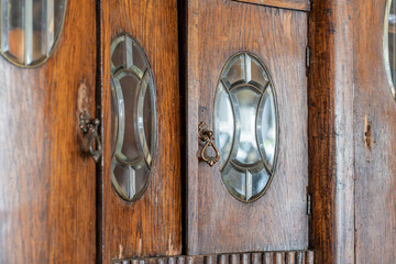 Abstract background of old, aged and grunge wooden locker with glass ornamental windows in HDR. Selective focus. Image with shallow depth of field