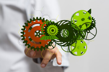 Mechanism, green metallic gears and cogs at work on brown background. Industrial machinery. 3D