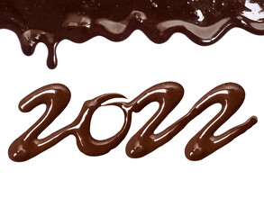 Date of the new year 2022 written by melted chocolate on a white background