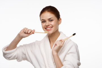 contact woman in white robe toothbrushes bathroom hygiene