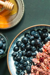 Berry mix bowl super food with healthy granola grain muesli in yogurt for breakfast food meal with honey blueberry strawberry
