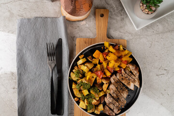 Italian Sheet Pan Pork Chops with Potatoes, Peppers, and Tomatoes 