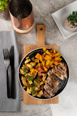 Italian Sheet Pan Pork Chops with Potatoes, Peppers, and Tomatoes 