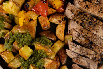 Italian Sheet Pan Pork Chops with Potatoes, Peppers, and Tomatoes 