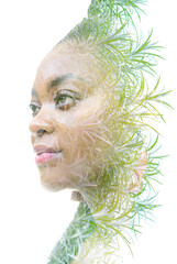 A double exposure portrait of a woman combined with an image of twigs. We are one with nature.