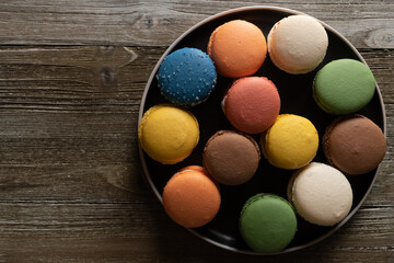 Fototapeta na wymiar Multicolored Macarons in a Kitchen 