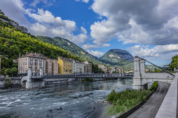 Picturesque Grenoble city view and the banks of Isere river. Grenoble, Auvergne-Rhone-Alpes region, France.