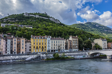 Fototapeta premium Picturesque Grenoble city view and the banks of Isere river. Grenoble, Auvergne-Rhone-Alpes region, France.