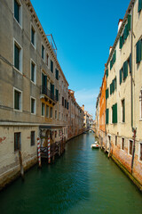 Obraz na płótnie Canvas Canal view in the city of Venice on a sunny day