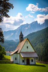 Fototapeta na wymiar Small mountain chapel in the val d'ega Italy on a sunny day 