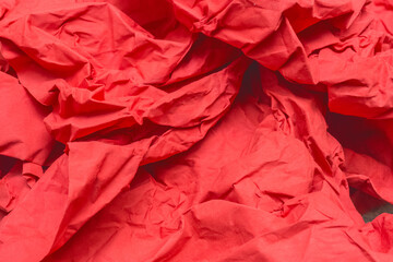 Shreds of old crumpled paper red close-up background