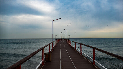 pier on the beach, bridge to the sea, wooden bridge in the sea