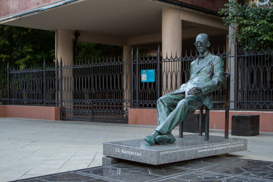 MOSCOW, RUSSIA - AUGUST 21, 2021 Monument to the architect Le Corbusier in the center of Moscow. Monument to the French architect Le Corbusier in front of avant-garde building (constructivism).